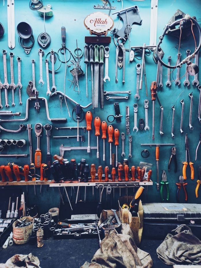 Mastering the First Impression: Your intriguing post title goes here A neatly arranged collection of tools on a workshop wall, perfect for automotive or repair themes.